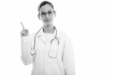 Genç güzel kadın doktor işaret parmağı kadar stüdyo çekim