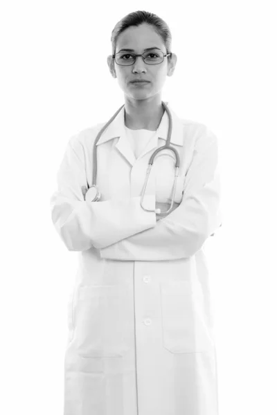 Studio shot of young beautiful woman doctor standing and wearing eyeglasses with arms crossed — Stock Photo, Image