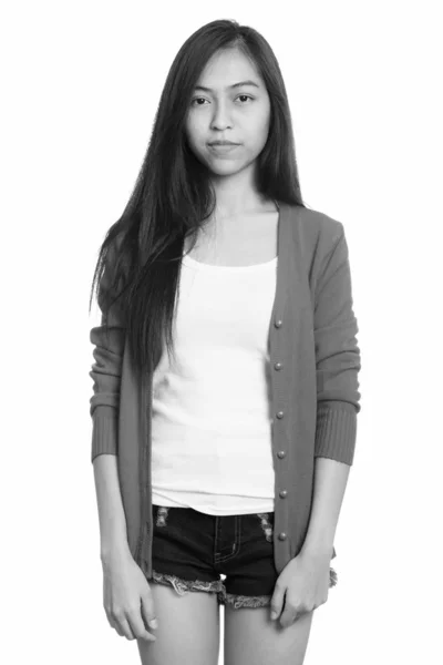 Studio shot of young Asian teenage girl standing — Stock Photo, Image