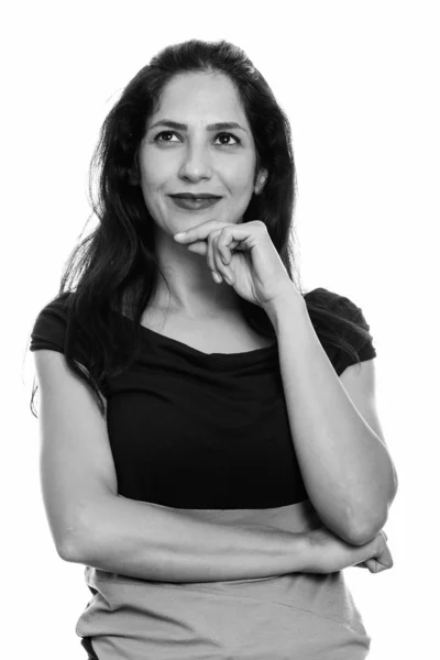 Close up of happy Persian woman smiling and thinking while looking up — Stock Photo, Image