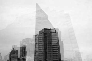 Low Angle View Of Multiple Exposure Of Tall Corporate Buildings In Black And White
