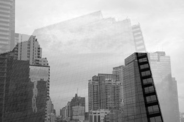 Low Angle View Of Multiple Exposure Of Tall Corporate Buildings In Black And White