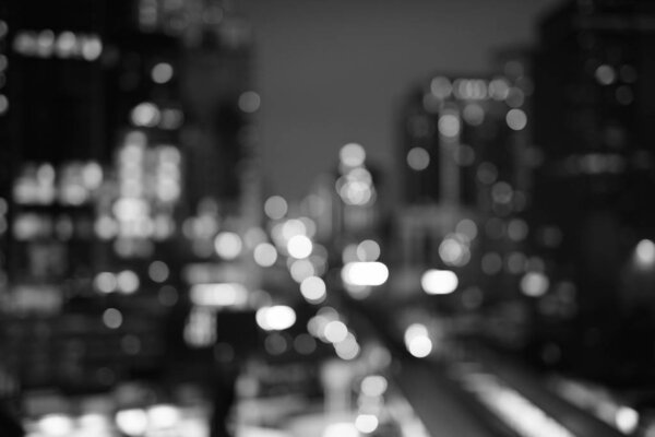 Defocused Shot Of Blurred View Of The City At Night In Black And White