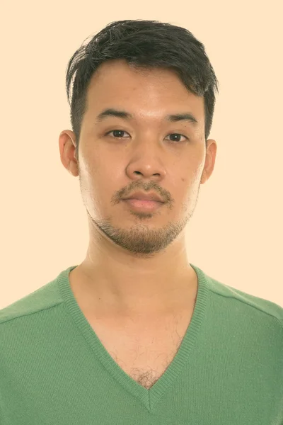 Studio shot of face of young Asian man — Stock Photo, Image