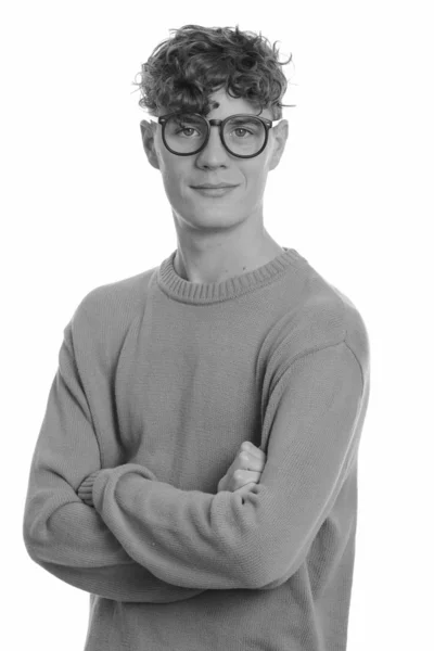 Giovane bel nerd uomo con i capelli ricci indossa occhiali — Foto Stock