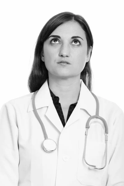 Face of beautiful woman doctor thinking while looking up — Stock Photo, Image