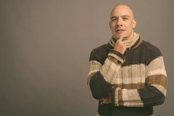 Portrait of handsome bald man against gray background — Stock Photo, Image