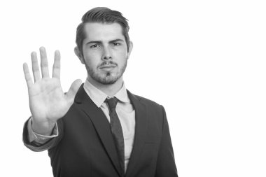 Genç yakışıklı beyaz işadamı stop el hareketi ile
