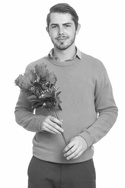 Young handsome Caucasian man holding red roses ready for Valentines day — 스톡 사진