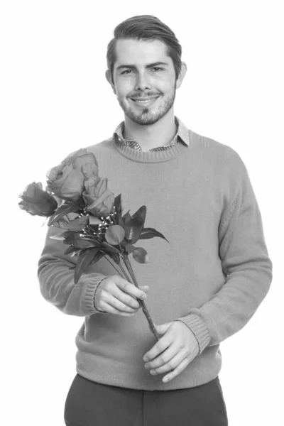 Young happy Caucasian man holding red roses ready for Valentines day — 스톡 사진