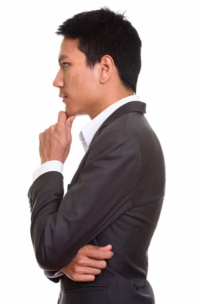 Profilo vista di giovane uomo d'affari asiatico pensiero — Foto Stock
