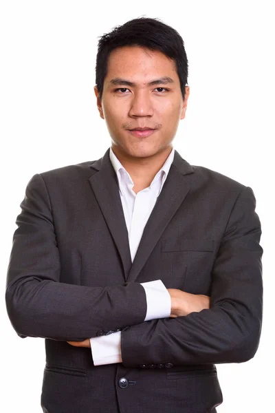 Primo piano di giovane uomo d'affari asiatico con le braccia incrociate — Foto Stock