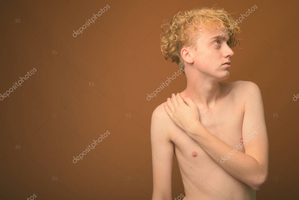 depositphotos_332687892-stock-photo-skinny-young-man-with-curly.jpg