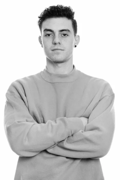 Studio shot of young man with arms crossed — Stock Photo, Image