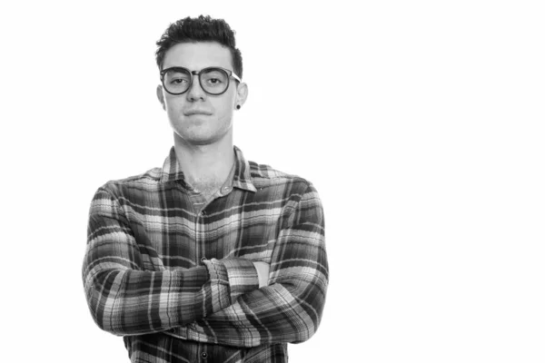 Studio shot of young man with arms crossed — Stock Photo, Image