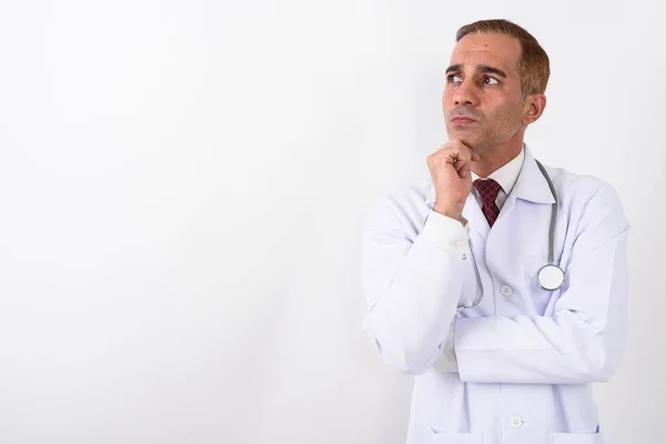 Portrait of mature handsome Persian man doctor — Stock Photo, Image