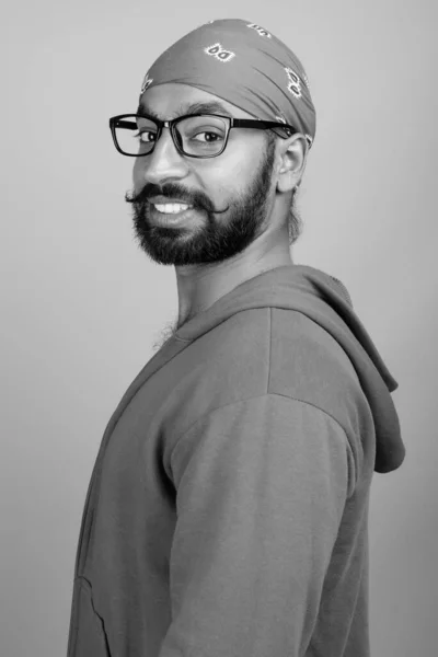 Studio Shot Young Handsome Bearded Indian Man Wearing Eyeglasses Gray — Stock fotografie