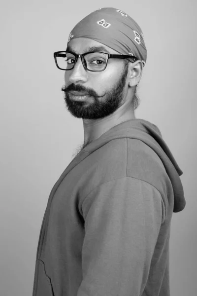 Studio Shot Young Handsome Bearded Indian Man Wearing Eyeglasses Gray — Stock Photo, Image