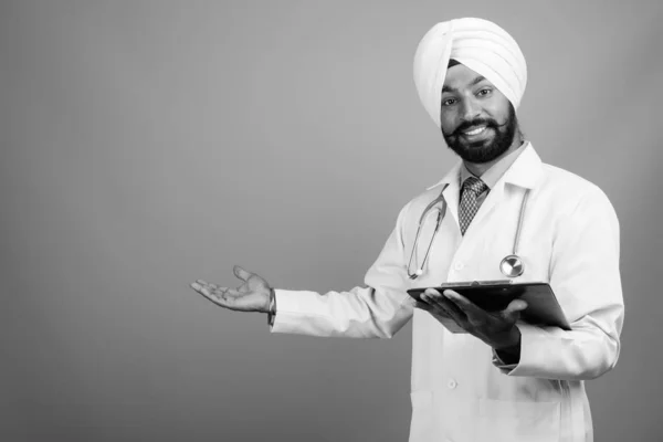 Studio Shot Young Handsome Bearded Indian Sikh Man Doctor Gray — Fotografia de Stock