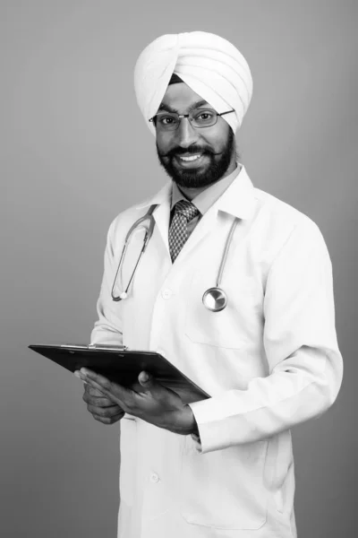 Studio Shot Young Handsome Bearded Indian Sikh Man Doctor Gray — Fotografia de Stock