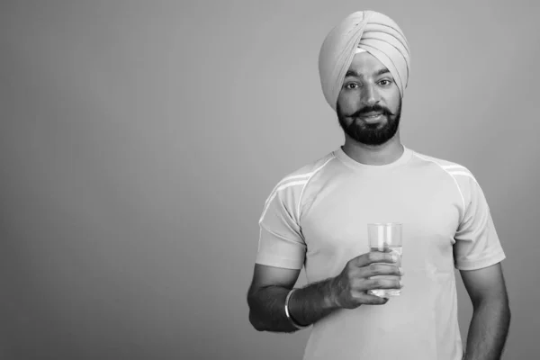 Studio Shot Young Handsome Bearded Indian Sikh Man Wearing Turban — Fotografia de Stock