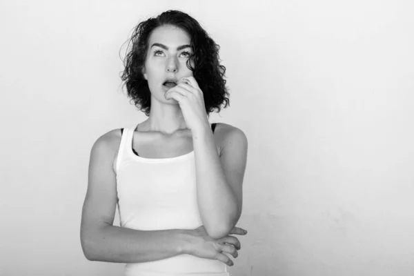 stock image Studio shot of young beautiful teenage girl isolated against white background in black and white