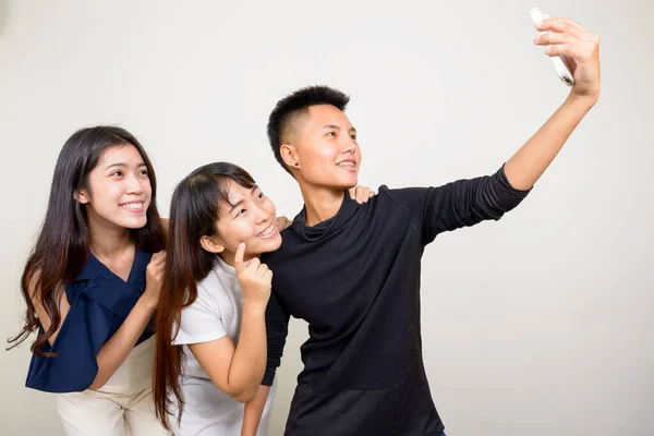 Studio Shot Three Young Beautiful Asian Women Friends Together White — Stockfoto