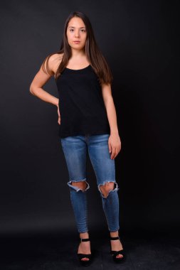 Studio shot of young multi ethnic beautiful woman against black background