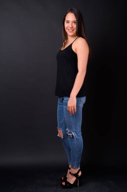 Studio shot of young multi ethnic beautiful woman against black background