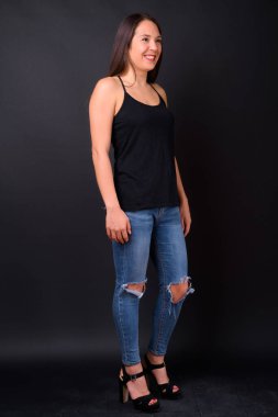 Studio shot of young multi ethnic beautiful woman against black background