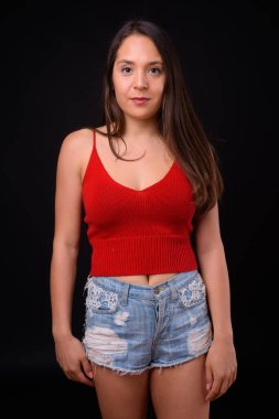 Studio shot of young multi ethnic beautiful woman against black background