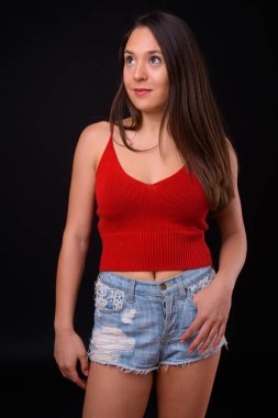 Studio shot of young multi ethnic beautiful woman against black background