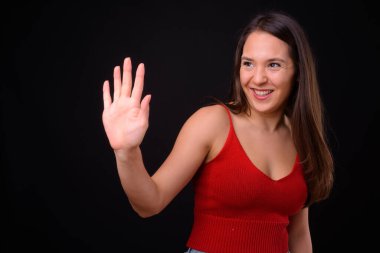 Studio shot of young multi ethnic beautiful woman against black background