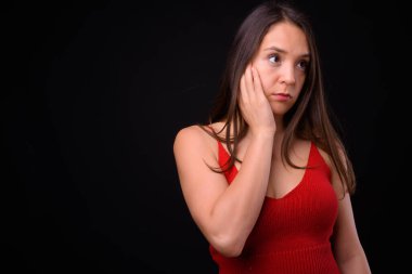 Studio shot of young multi ethnic beautiful woman against black background