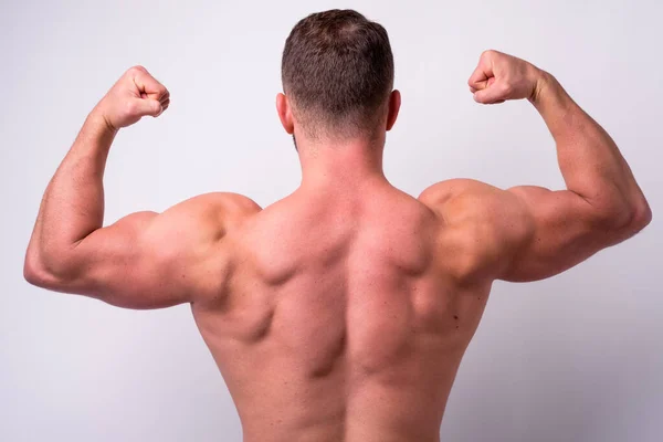 Studioaufnahme Eines Muskulösen Bärtigen Mannes Ohne Hemd Vor Weißem Hintergrund — Stockfoto