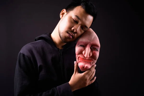 Studio Shot Young Asian Man Hoodie Horror Mask Black Background — Stock Fotó