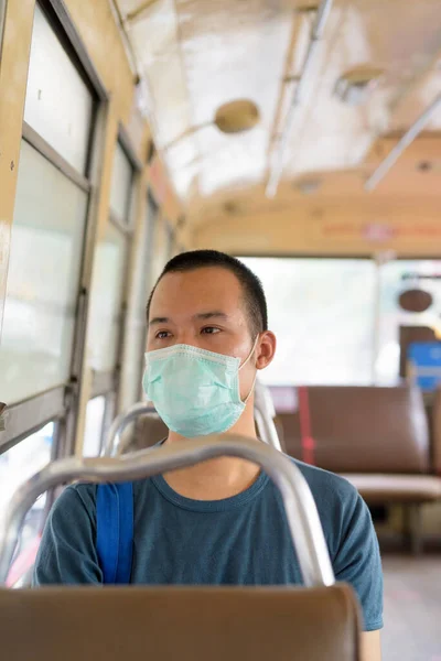 Portrait Young Asian Man Mask Protection Corona Virus Outbreak Riding — Stock Fotó