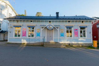 Portrait of Moomin shop with blue painted wooden exterior in Naantali Finland