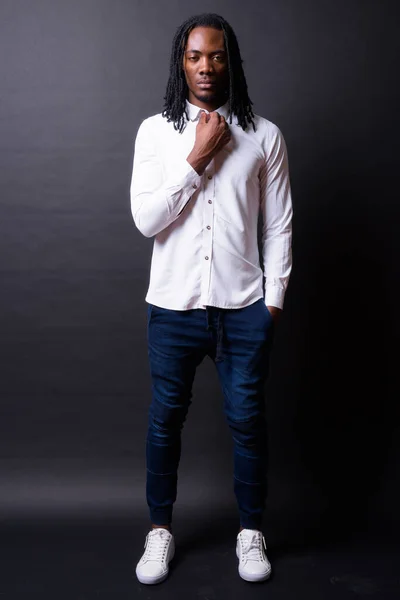 Studio Shot Young Handsome African Businessman Dreadlocks Black Background — Stockfoto