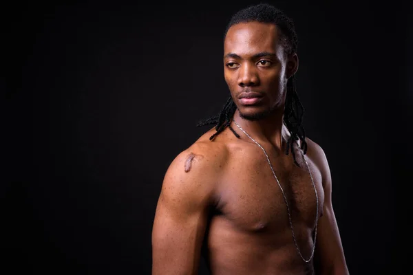 Studio Shot Young Handsome African Man Dreadlocks Shirtless Black Background —  Fotos de Stock
