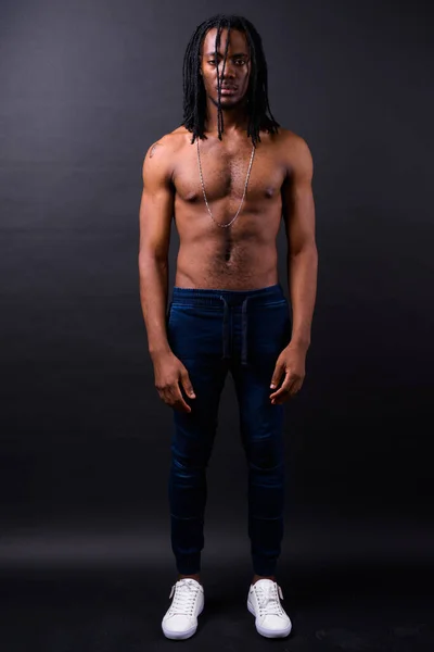 Studio Shot Young Handsome African Man Dreadlocks Shirtless Black Background — Stok fotoğraf