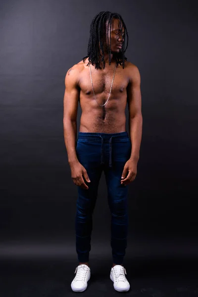 Studio Shot Young Handsome African Man Dreadlocks Shirtless Black Background — Stockfoto