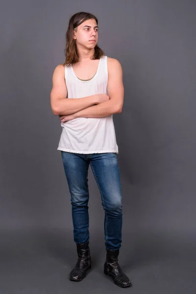 Studio Shot Young Handsome Androgynous Man Long Hair Gray Background — Stockfoto