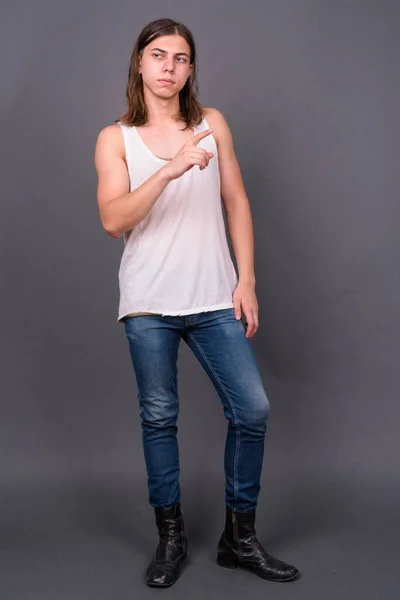 Studio Shot Young Handsome Androgynous Man Long Hair Gray Background — Stockfoto