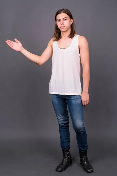 Studio Shot Young Handsome Androgynous Man Long Hair Gray Background — Stockfoto