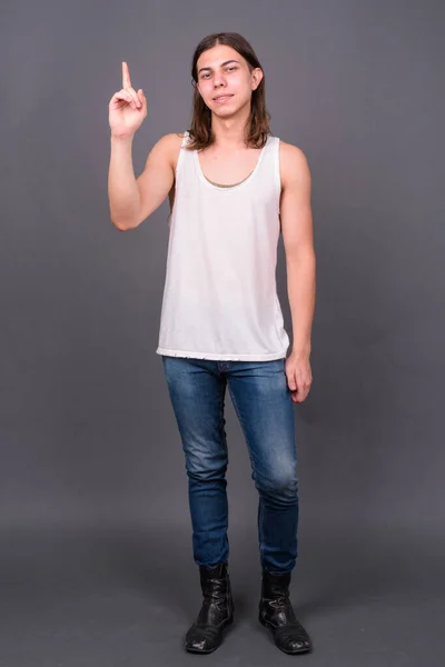 Studio Shot Young Handsome Androgynous Man Long Hair Gray Background — Stockfoto