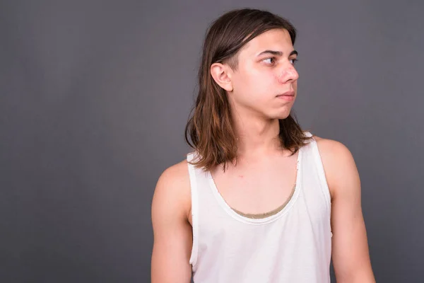 Studio Shot Young Handsome Androgynous Man Long Hair Gray Background — ストック写真