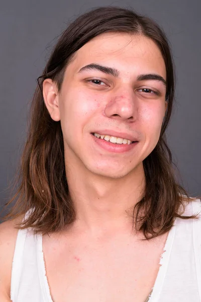 Studio Shot Young Handsome Androgynous Man Long Hair Gray Background — Stockfoto