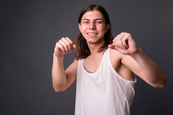 Studio Shot Young Handsome Androgynous Man Long Hair Gray Background — Stockfoto