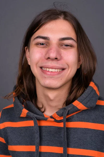 Studio Shot Young Handsome Androgynous Man Long Hair Wearing Hoodie — Zdjęcie stockowe